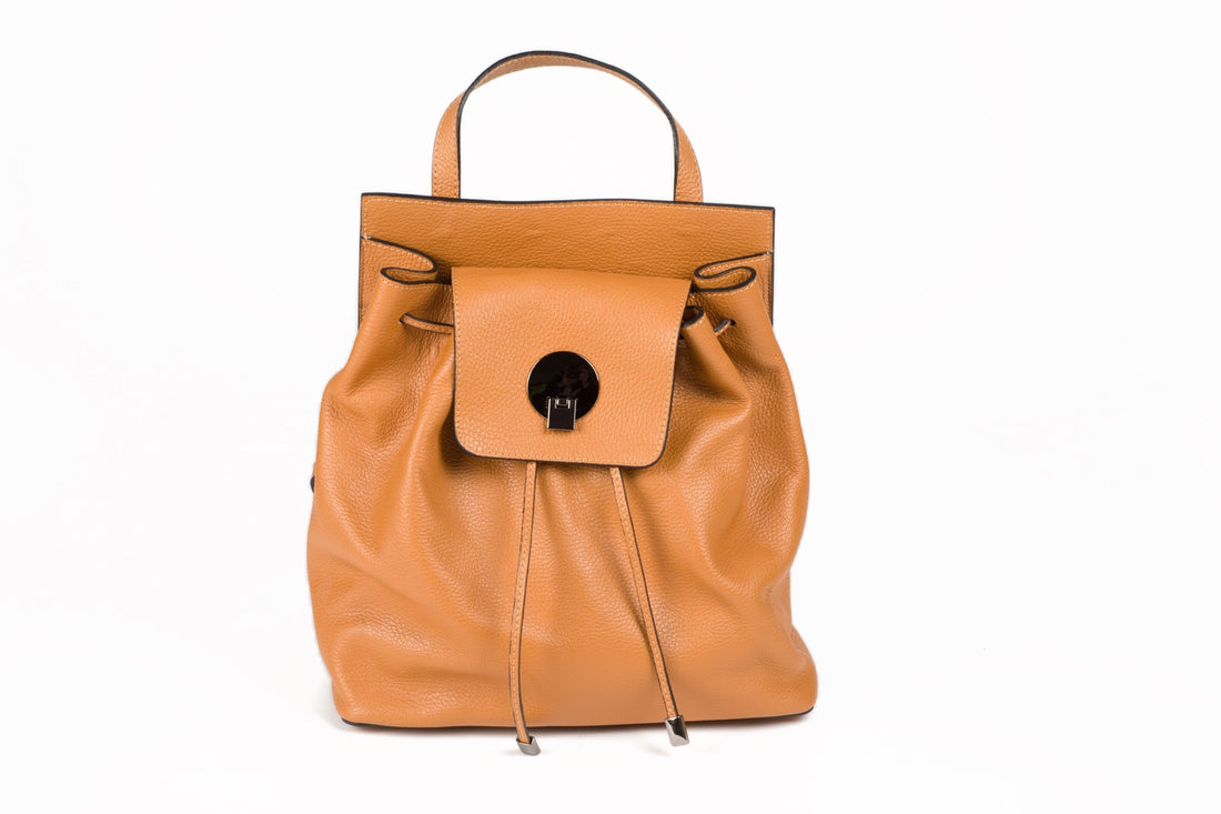 Tan Italian leather drawstring top backpack front view