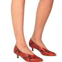 Italian leather red snakeskin kitten heel pumps with pointed toe and deep V cut on model