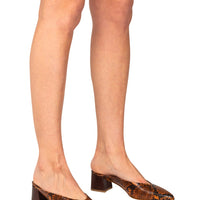 Italian leather brown snakeskin mule with low block heel in metallic brown on model