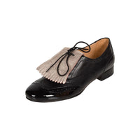 Black italian leather brogues with detachable and reversible nude metallic fringe 